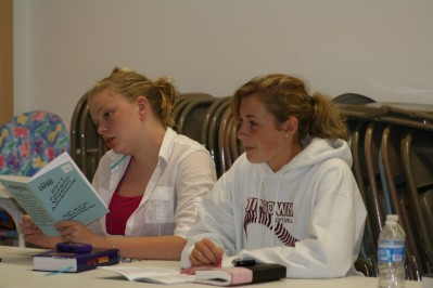 Liz & Caitlyn Participate in Evening Devotion Discussion