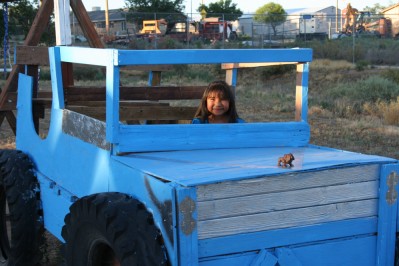Girl Sitting in Playground Truck