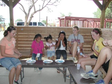 Hayli, Caitlyn & Sarah Help the Children with the Day's Craft