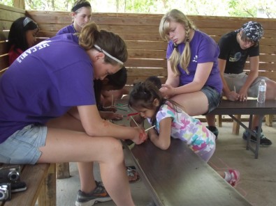 Liz, Caitlyn, Sarah & Matt Help Children with Crafts