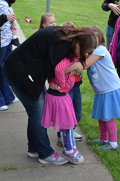 Kathy Hugging Child