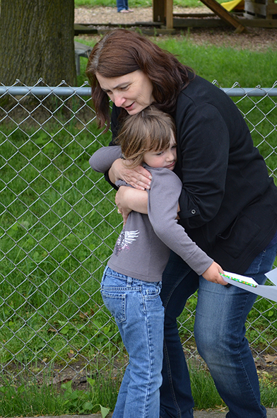 Kathy Hugging Child