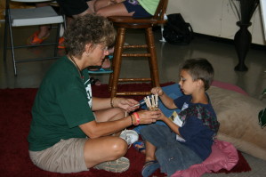 Teaching Child to Weave Basket