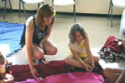 Teaching Child to Tie Blanket Edge