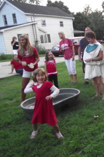 Child Throwing Water Balloon