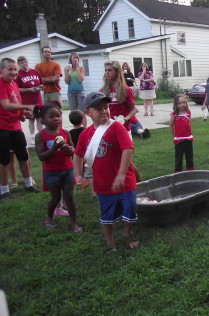 Child Throwing Water Balloon