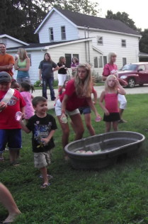 Child Throwing Water Balloon