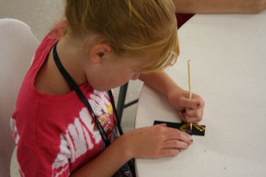 Girl Decorating Cross