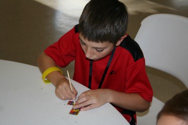 Boy Decorating Cross