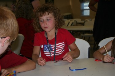 Girl Decorating Cross