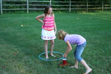 Child Filling Cup with Water