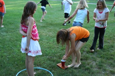 Child Filling Cup with Water