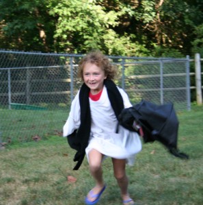 Girl Running with Bag Clothing Articles