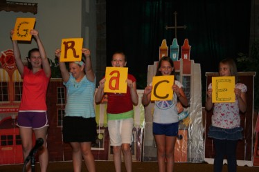 Youth & Children Holding Letters Spelling GRACE