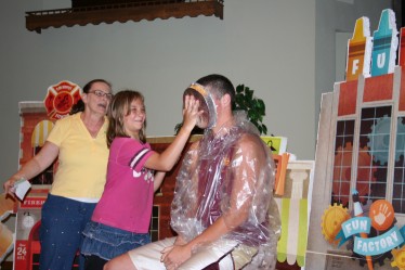 Child Throwing Pie at Augie