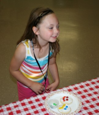 Child Decorating Cookie