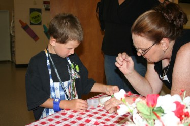 Becky Helping Child with Snack