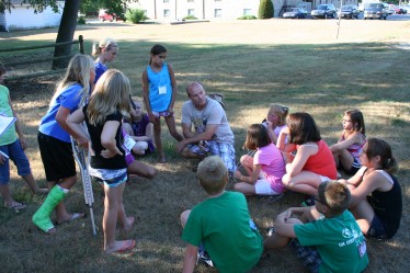 Mark Talks with Children During Game Time