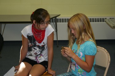Children Experimenting with a Compass