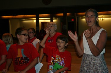 Children and Teachers Singing