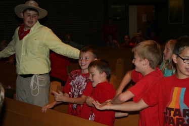 Children and Teachers Singing