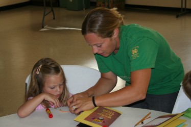 Rachael Helping Child with Crafts