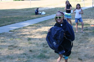 Girl Running with Assorted Clothes On