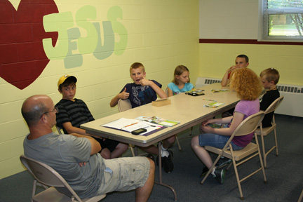 Children in Classroom Learning about "Serving Friends"