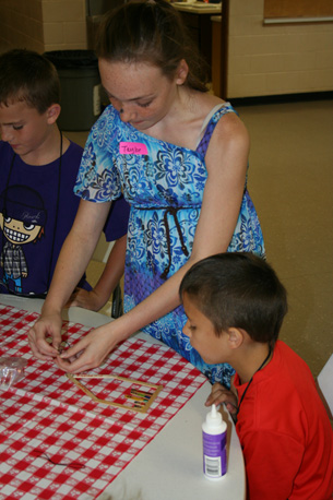 Youth Helping Build Popsicle House