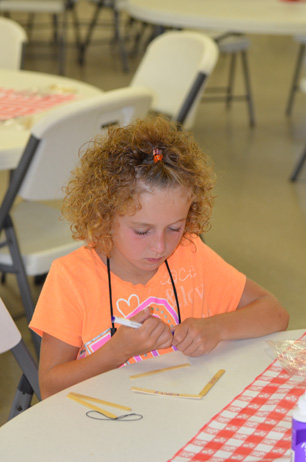 Child Building Popsicle House