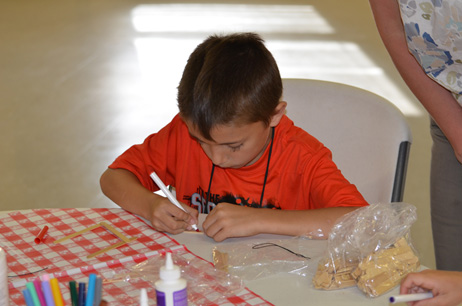 Child Building Popsicle House