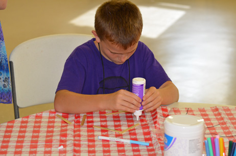 Child Building Popsicle House