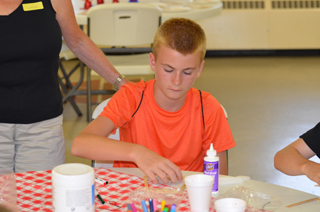 Child Building Popsicle House