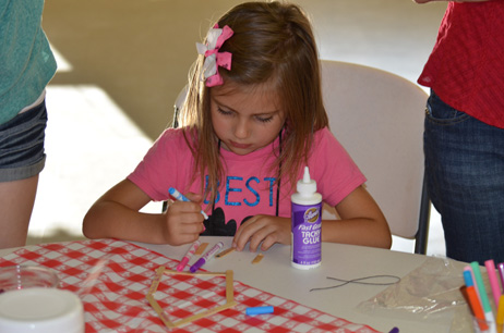 Child Building Popsicle House