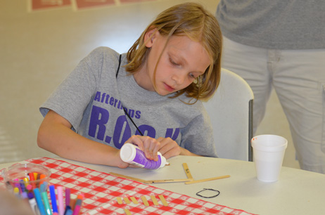 Child Building Popsicle House