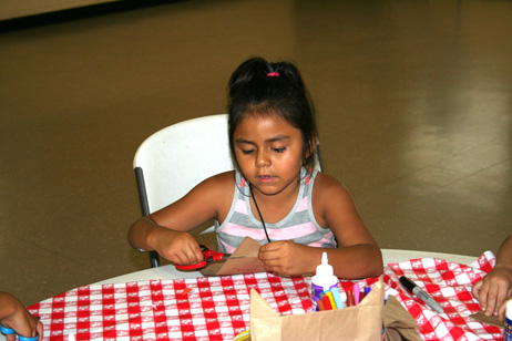 Child Making "Popcorn Pal" Bag