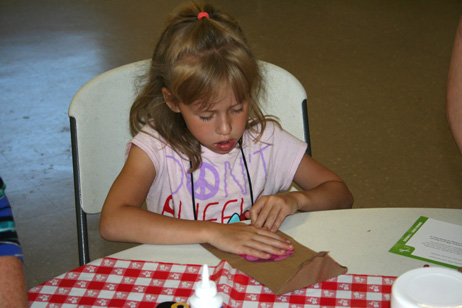 Child Making "Popcorn Pal" Bag