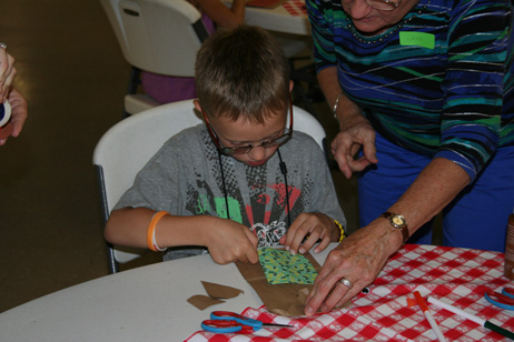 Child Making "Popcorn Pal" Bag