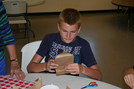 Child Making "Popcorn Pal" Bag