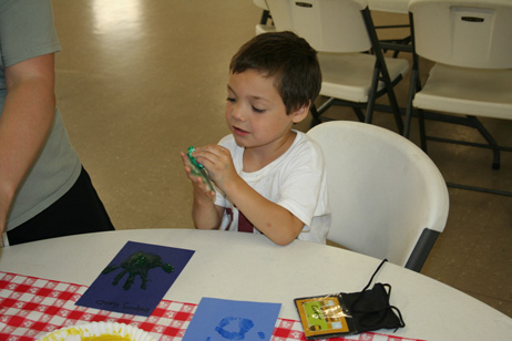 Boy Making Handprint