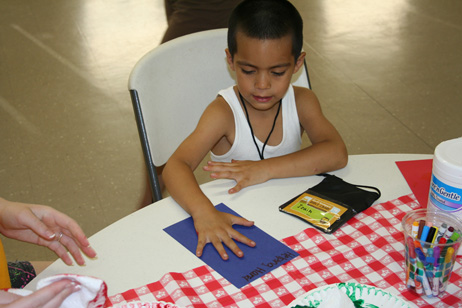 Boy Making Handprint