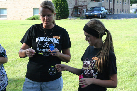 Volunteers Passing Soap Bubbles