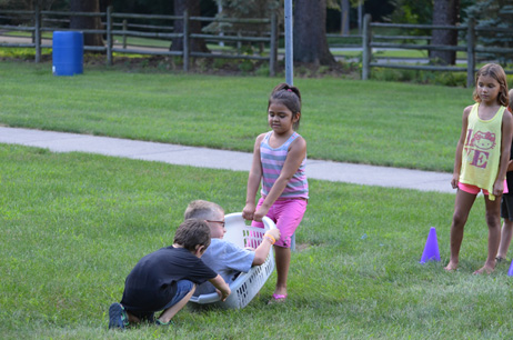 Girl Pulling, Boy Pushing  Boy in Laundry Basket