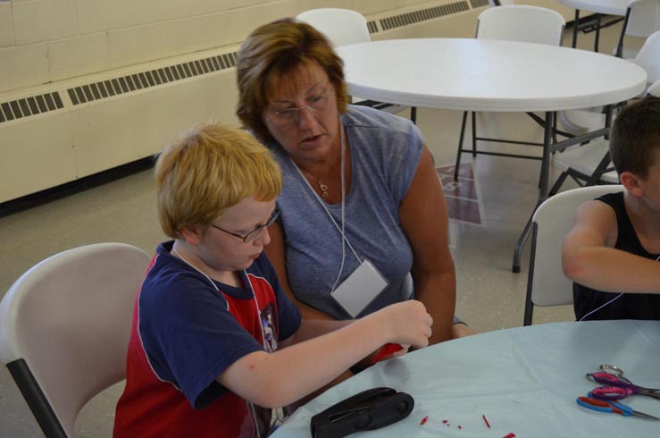 Linda Helping Boy with Crab