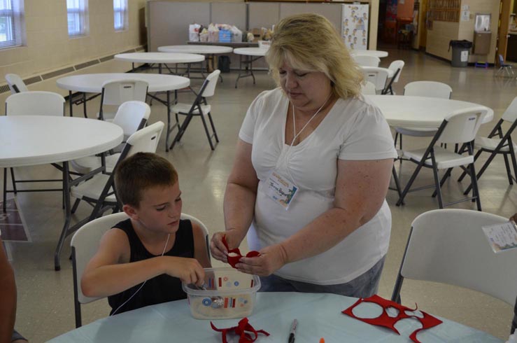 Teresa Helping Boy with Crab