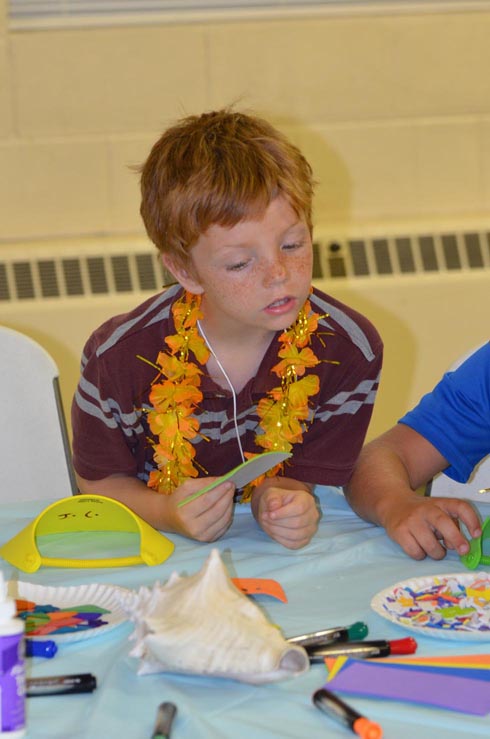 Boy Decorating Sun Visor