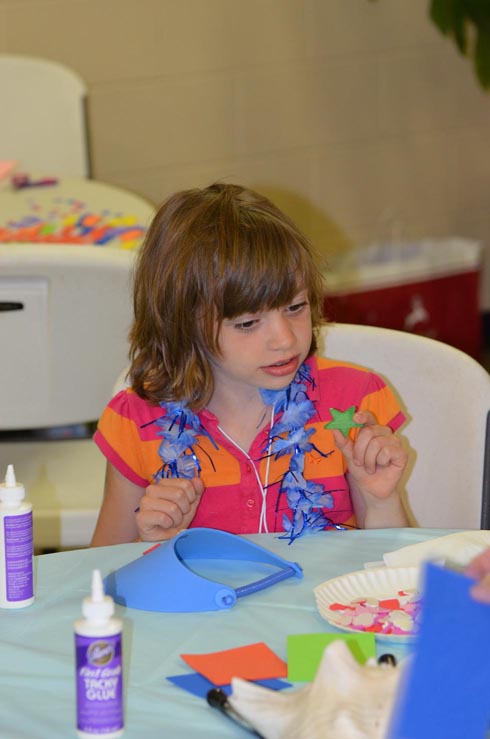 Girl Decorating Sun Visor