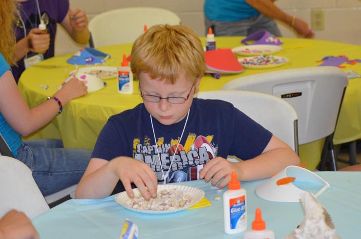 Boy Decorating Sun Visor