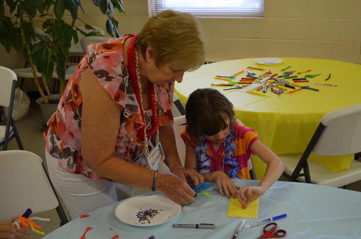 Roberta Helping Girl Make Dragon Fly