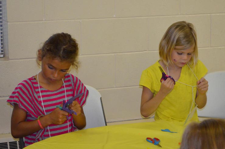 Girls Making Dragon Flies